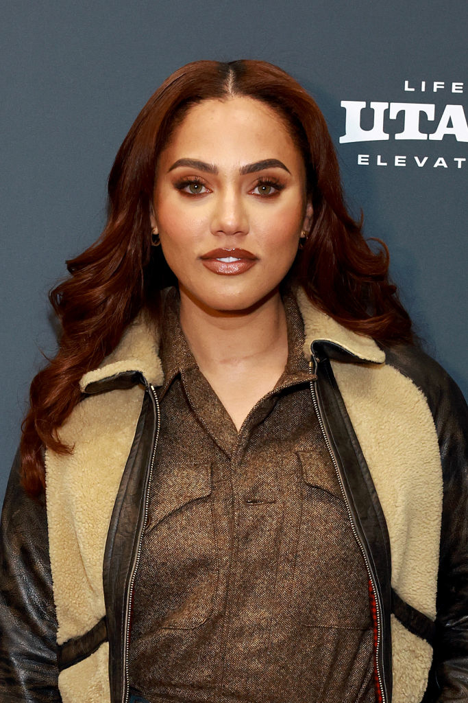 Close-up of Ayesha at a media event in a jacket