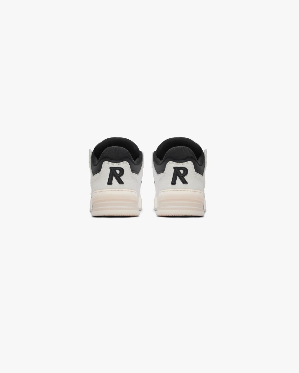 Rear view of a pair of sneakers with prominent &#x27;R&#x27; logo on the back