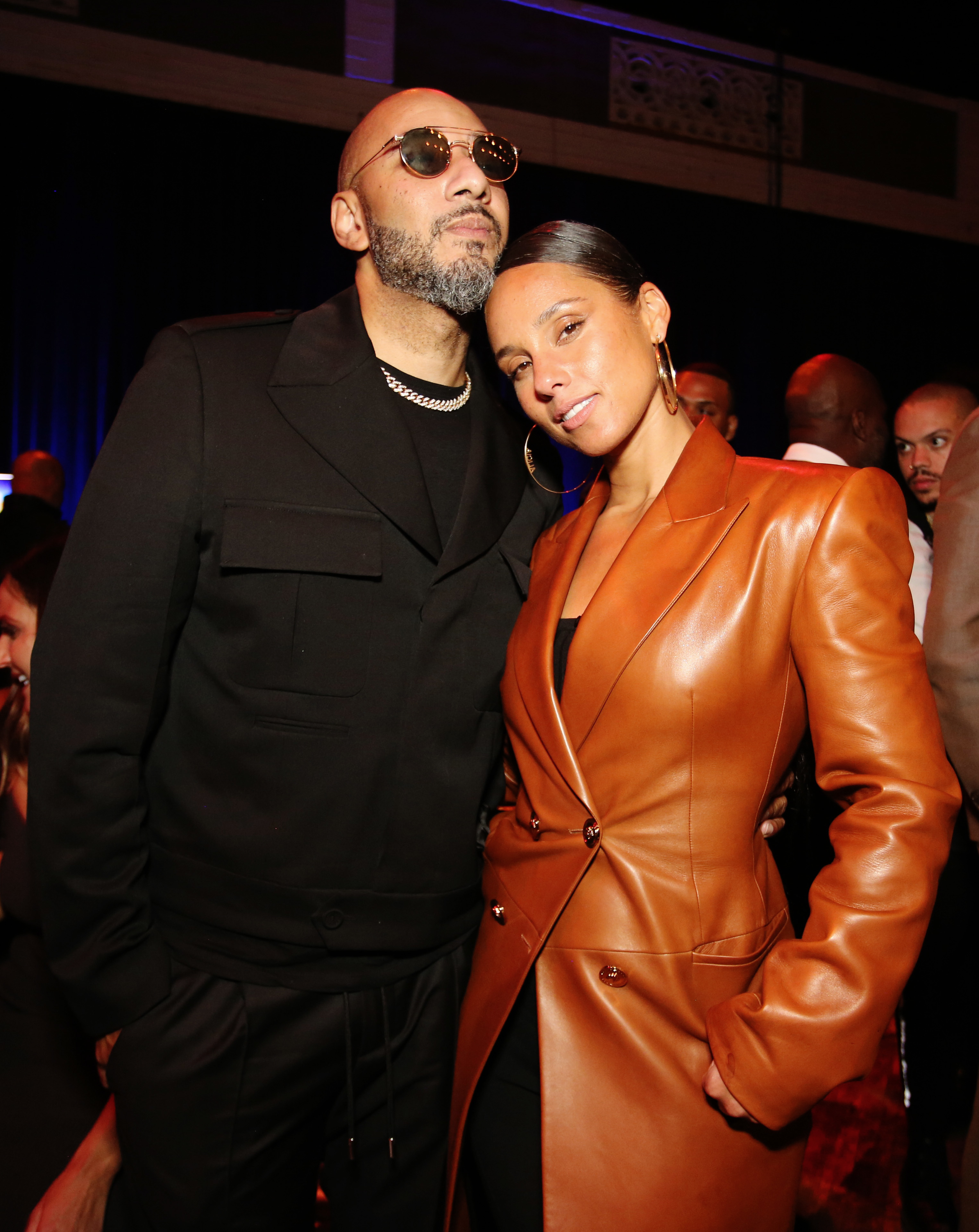 Alicia Keys in a leather jacket with Swizz Beatz