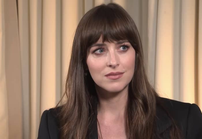 Dakota Johnson in an interview with &quot;Entertainment Tonight,&quot; with a video playback bar at the bottom