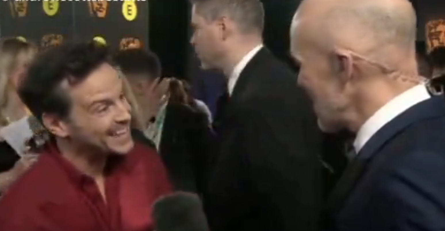 A closeup of Andrew Scott on a red carpet interview
