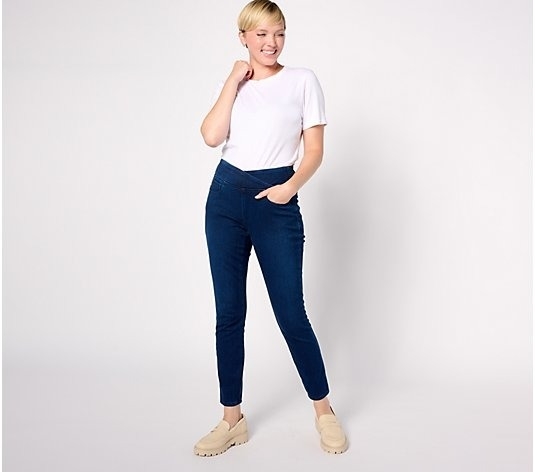 model wearing jean leggings with crossover waist