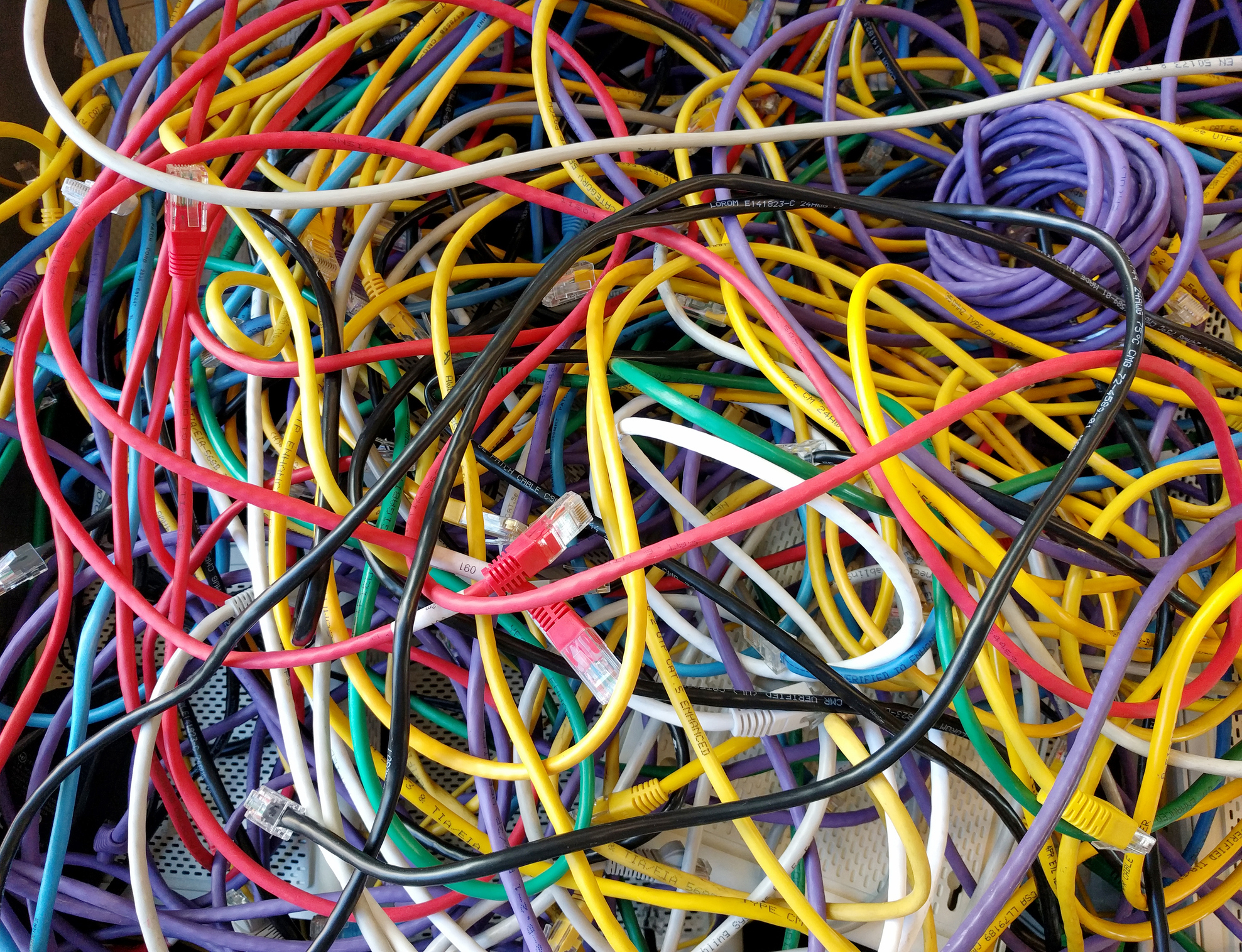 A tangled assortment of various cables