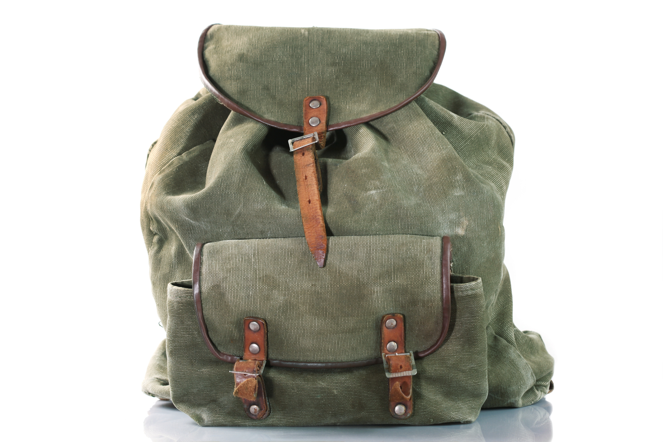 Vintage canvas backpack with leather straps, standing upright