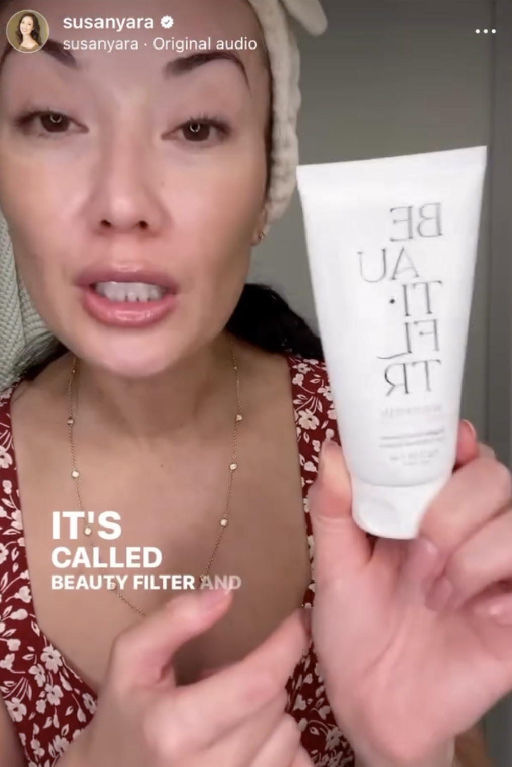 Woman showcasing a beauty product tube with text overlay &quot;IT&#x27;S CALLED BEAUTY FILTER AND&quot;
