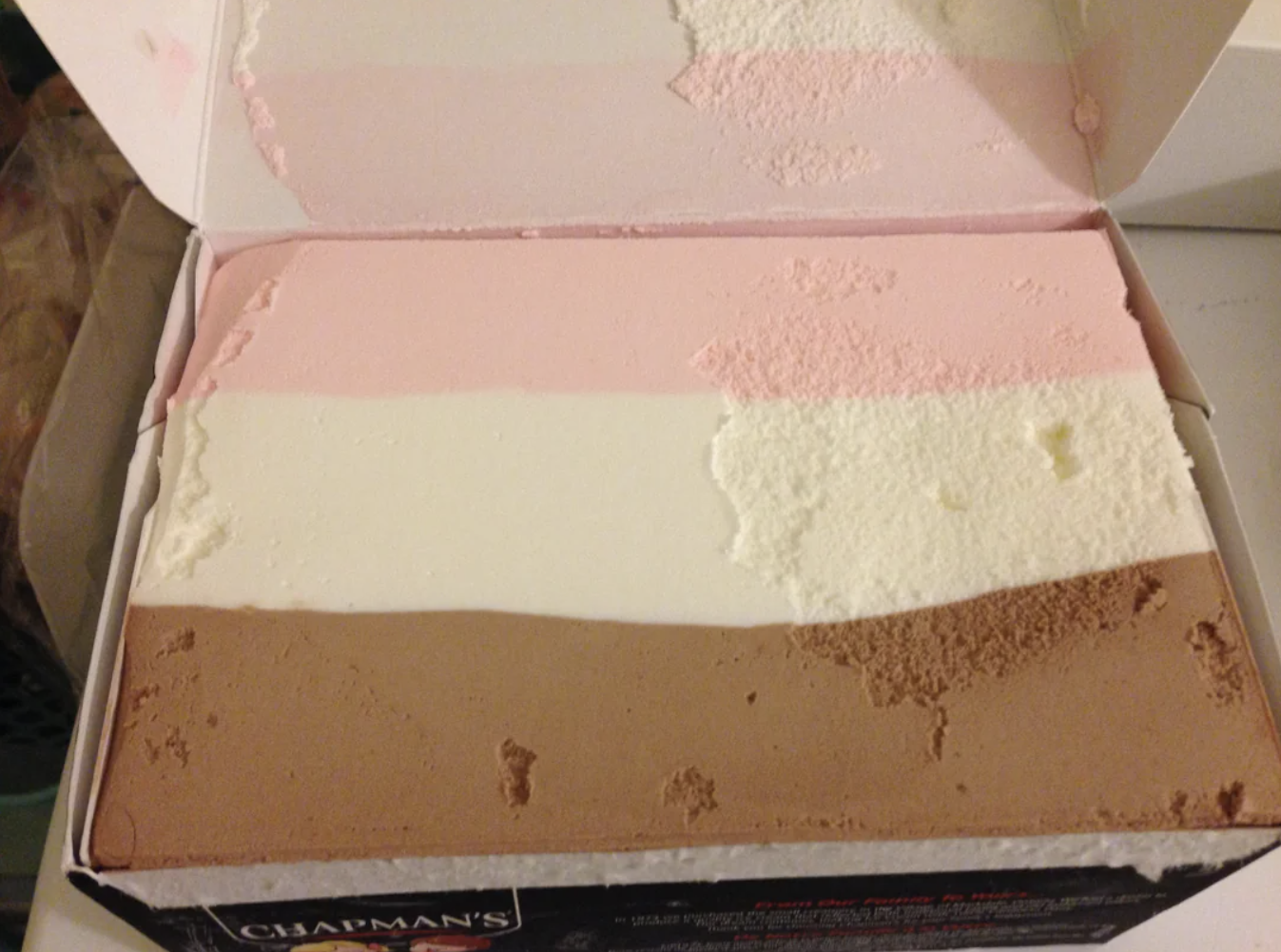 Retro square &quot;Neapolitan&quot; ice cream box with three flavors: strawberry, vanilla, and chocolate