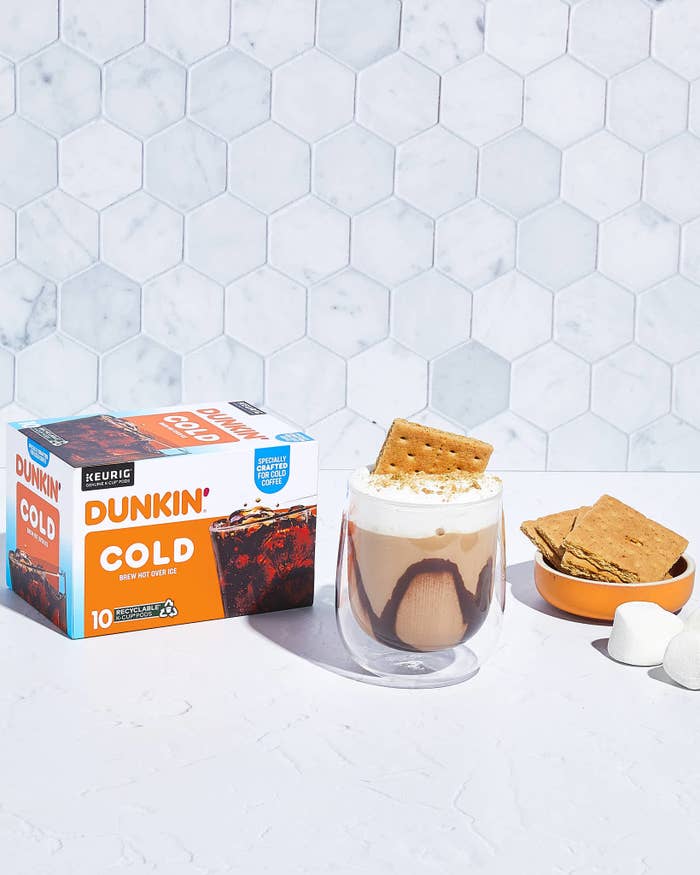 Dunkin&#x27; Cold Brew coffee box beside a s&#x27;mores-flavored iced coffee and ingredients