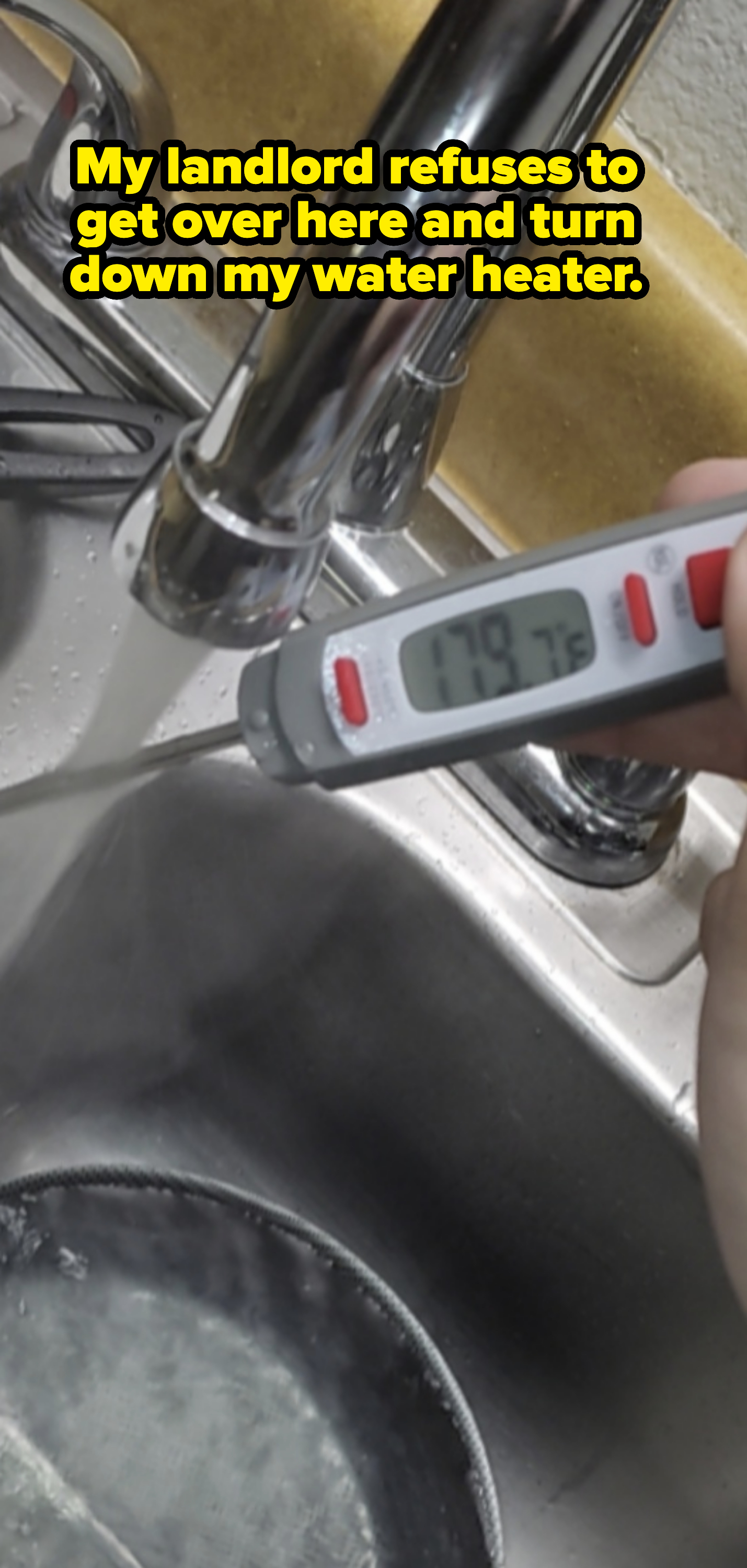Thermometer displaying a temperature of 179°F while being held under running tap water in a sink