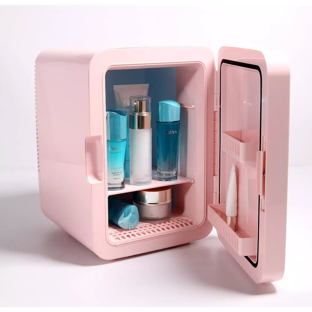 mini skincare fridge with open door displaying various cosmetic products inside