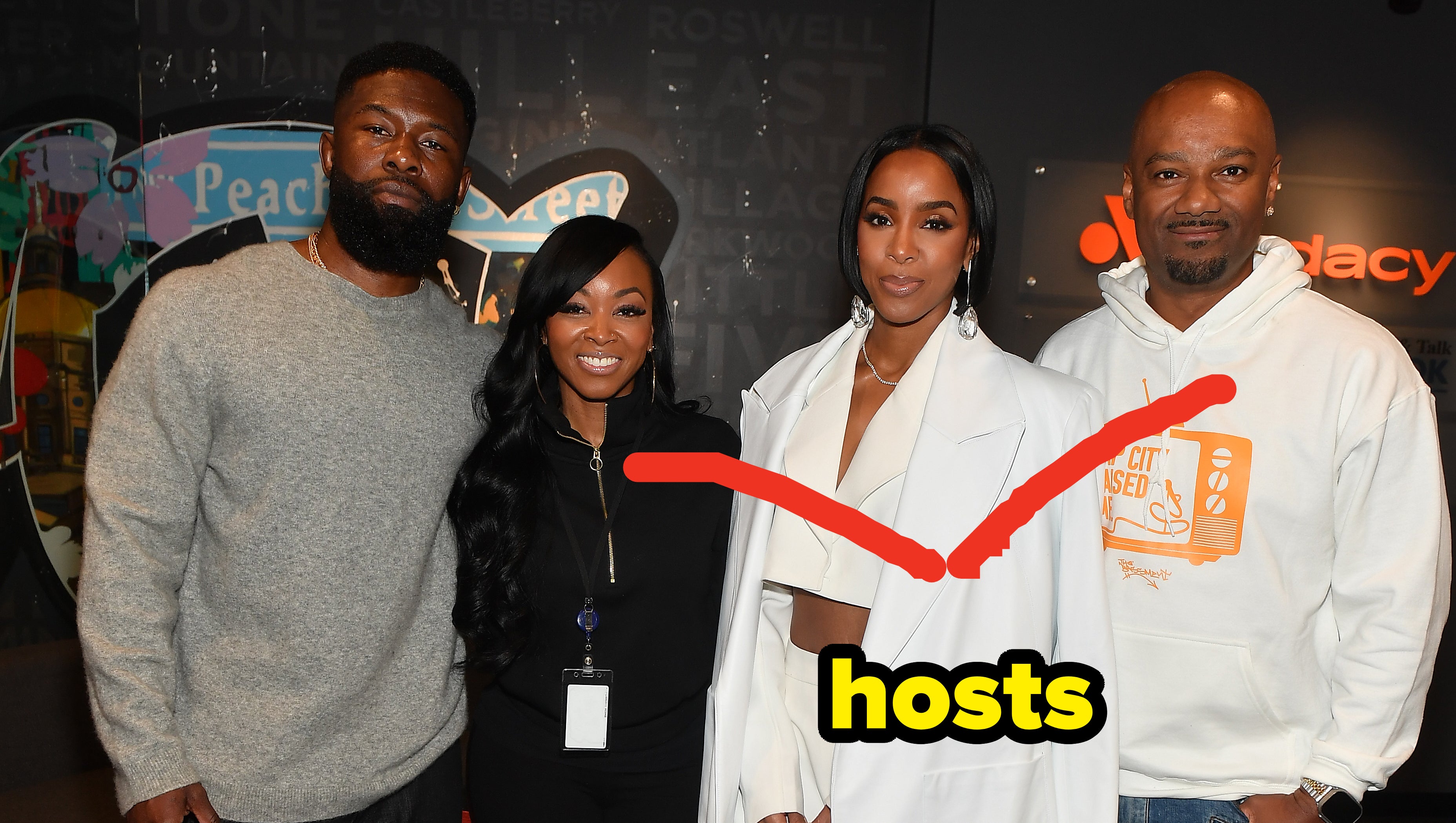 Kelly Rowland with the hosts of V-103 Atlanta
