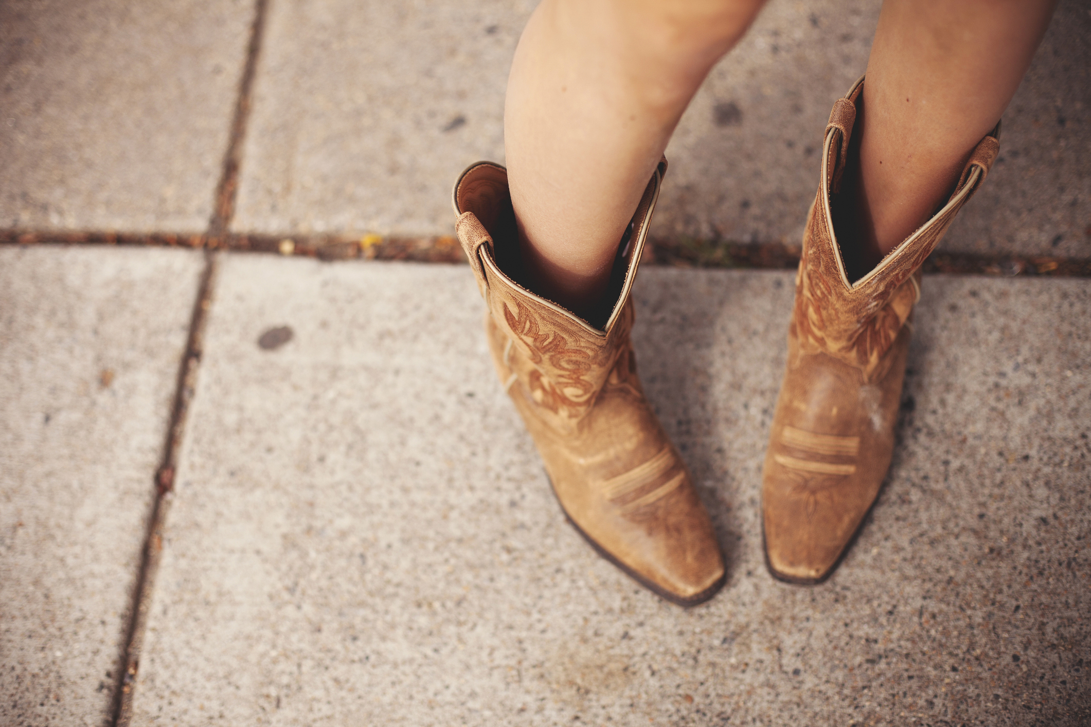 View of woman wearing Western-style boots