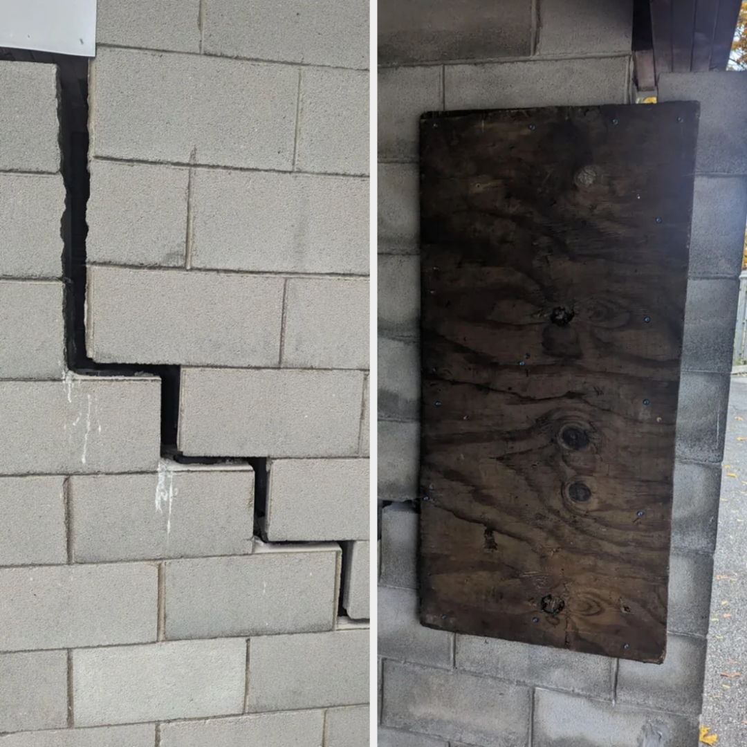 Cracked wall repaired with mismatched wooden board