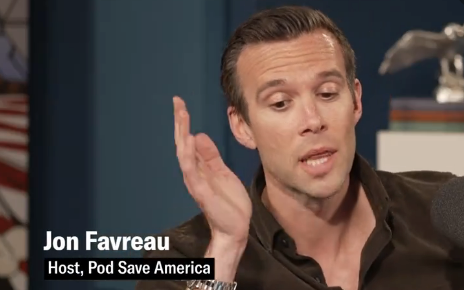 Jon Favreau speaks animatedly, captioned as host of Pod Save America