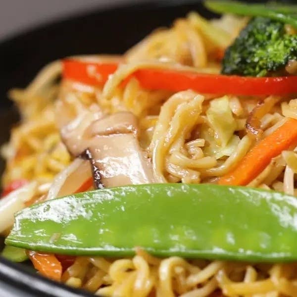 Close-up of vegetable stir-fry with noodles in a bowl