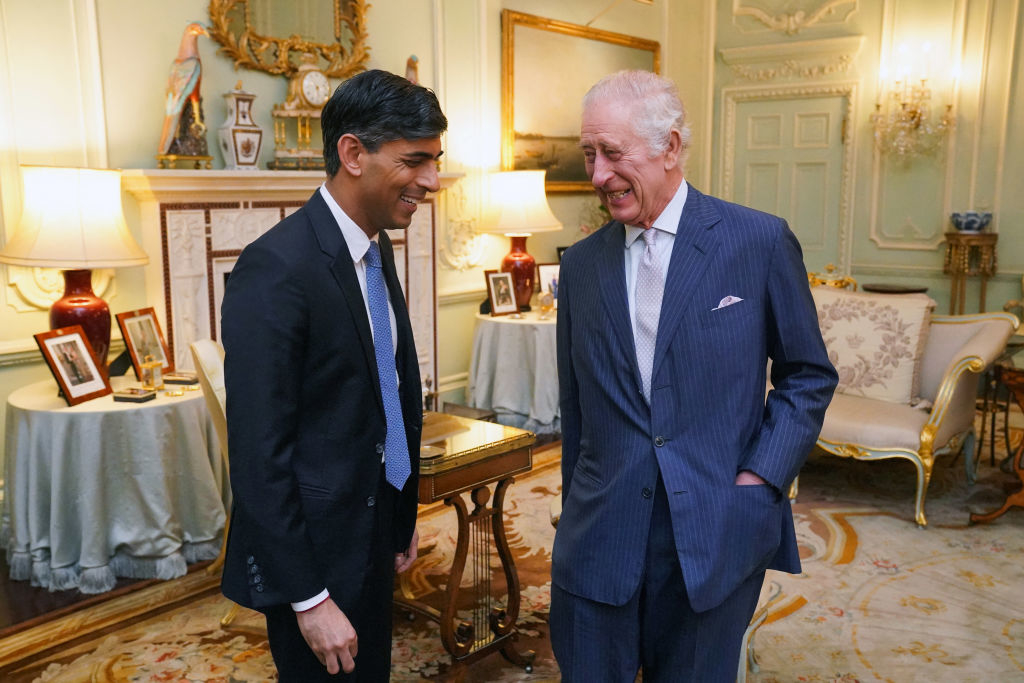 Britain&#x27;s King Charles III (R) speaks with Britain&#x27;s Prime Minister Rishi Sunak at Buckingham Palace, in central London, on February 21, 2024 for their first in-person audience since the King&#x27;s diagnosis with cancer