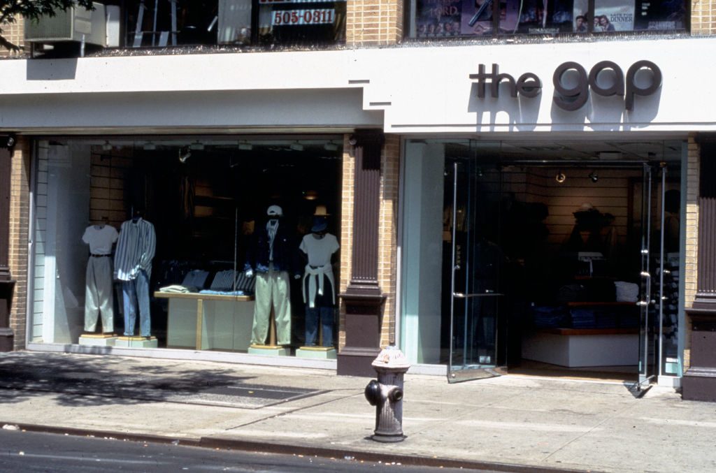 Storefront of &quot;the GAP&quot; with mannequins wearing casual attire
