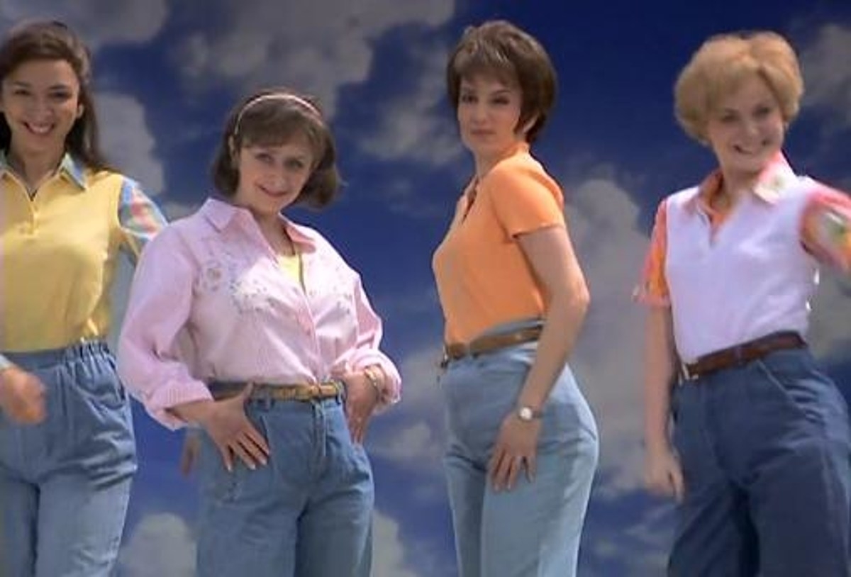 Four women in high-waisted jeans and casual tops, posing confidently with hands on hips