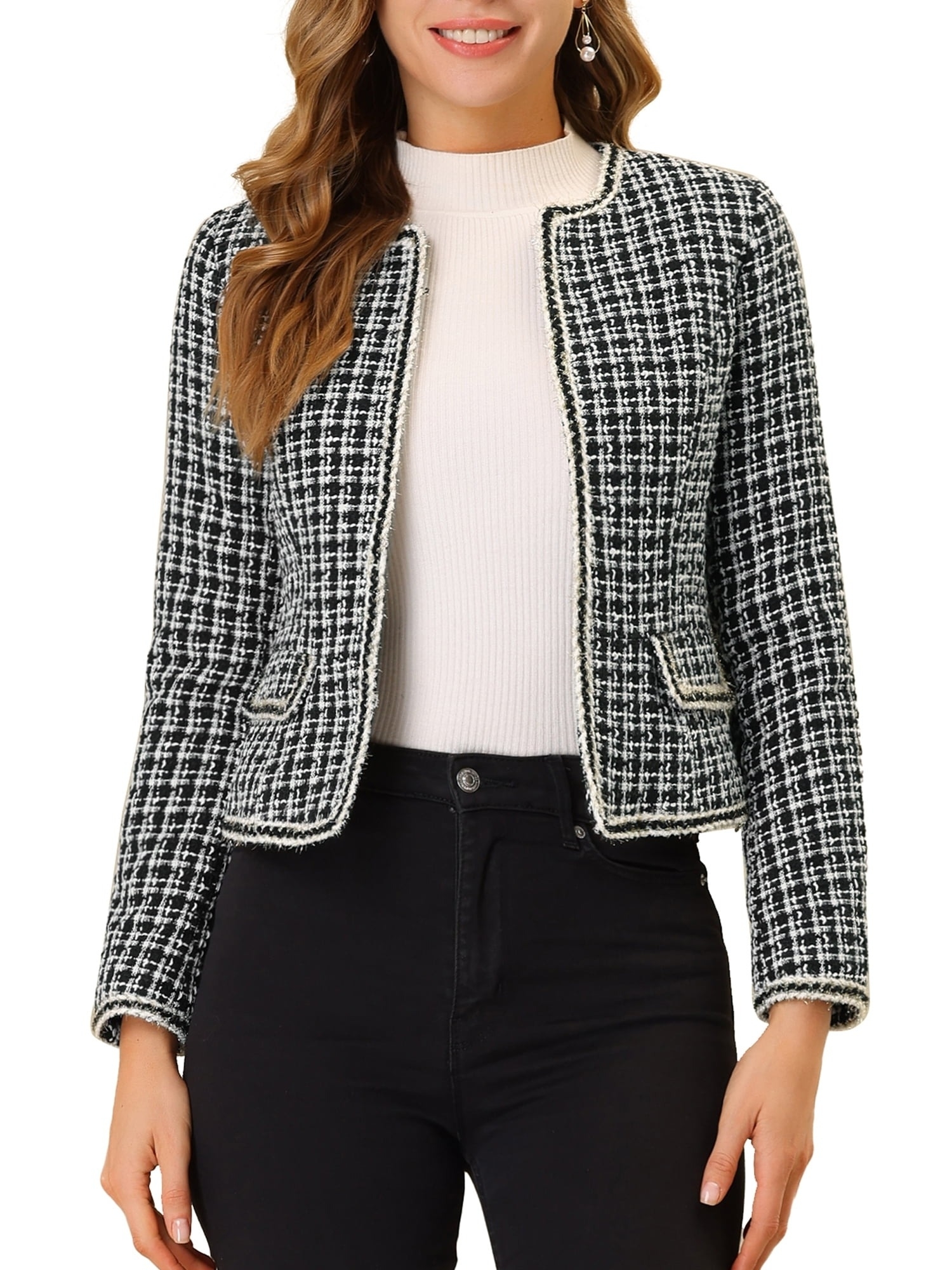 model wearing a houndstooth jacket and black jeans
