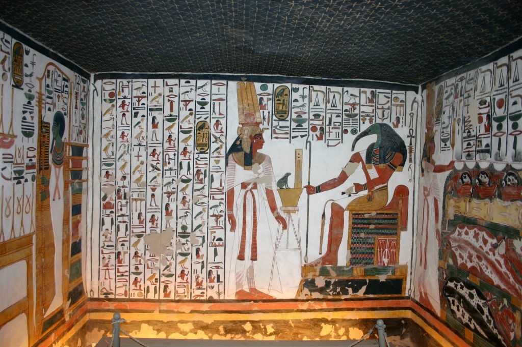 Ancient Egyptian tomb paintings, with figures and hieroglyphics