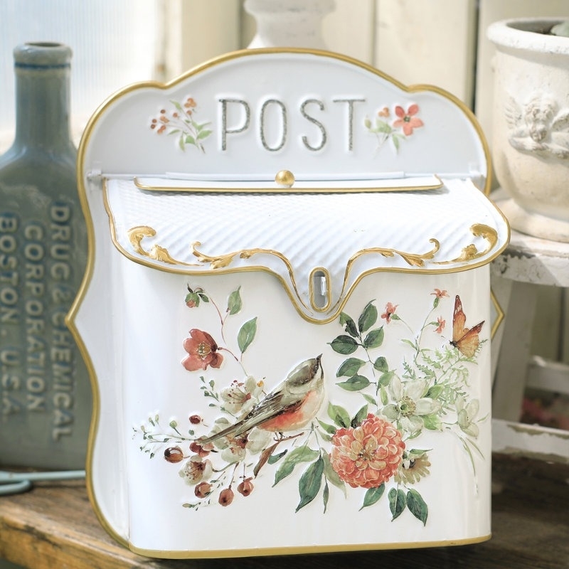 Vintage-style mailbox adorned with floral and bird design, labeled &quot;POST&quot; on top