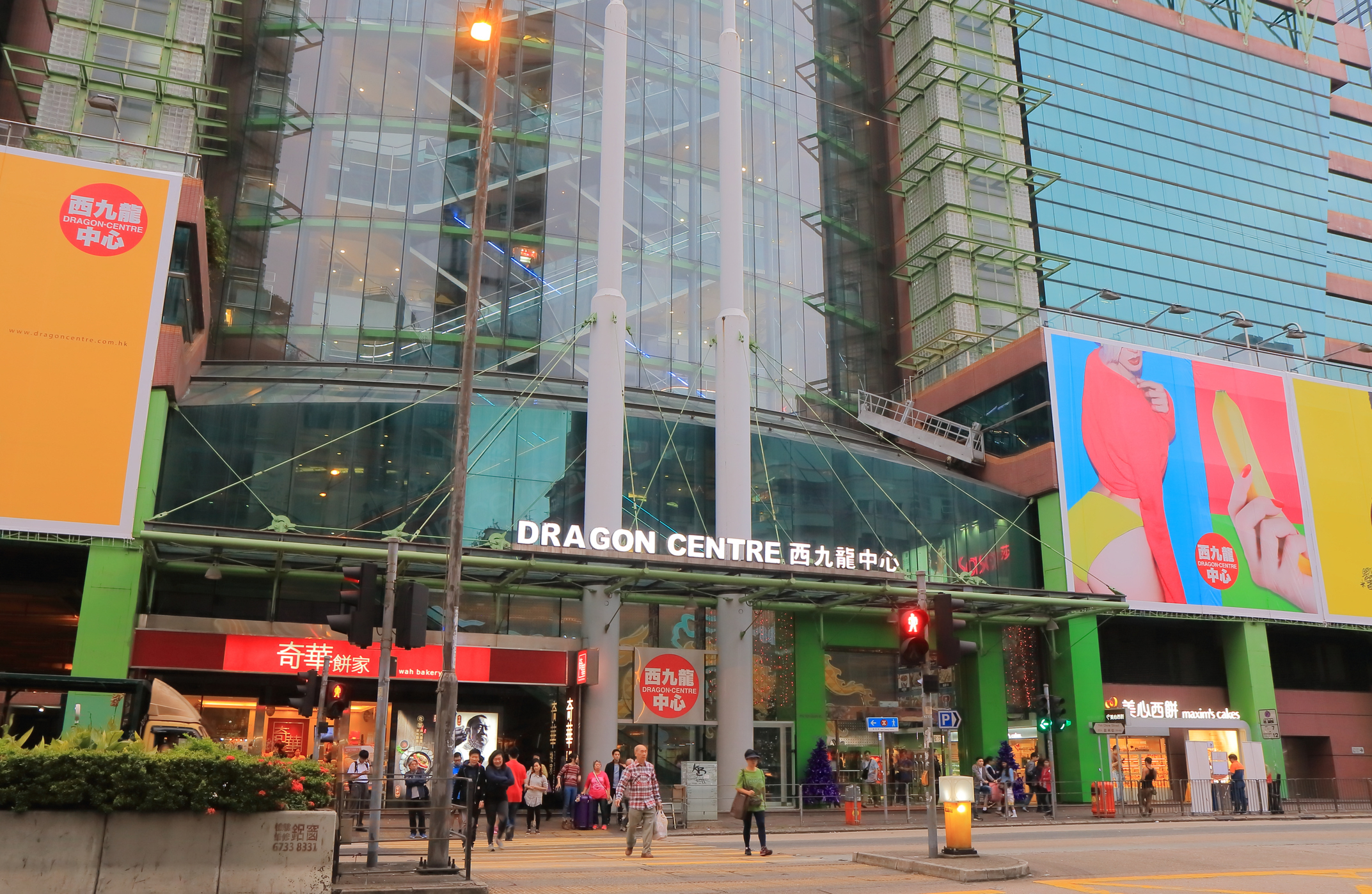 Entrance of Dragon Centre mall in an urban setting with pedestrians and signage