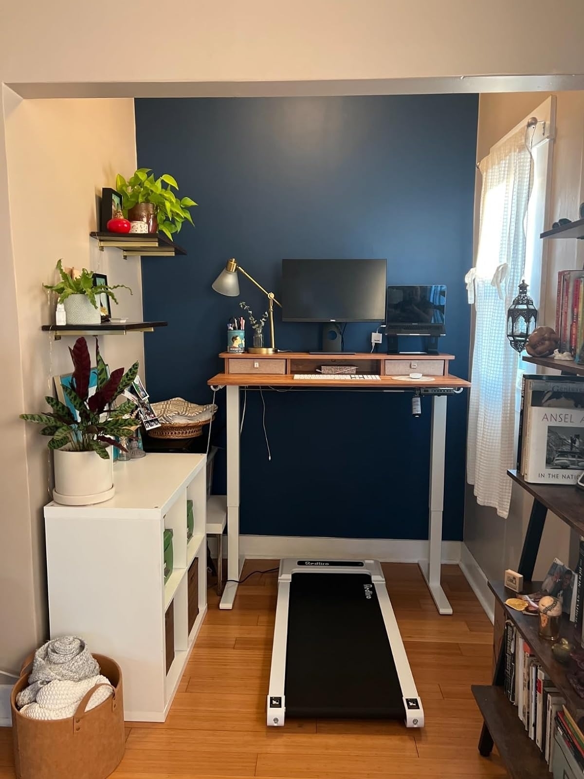 white and black walking pad under standing desk