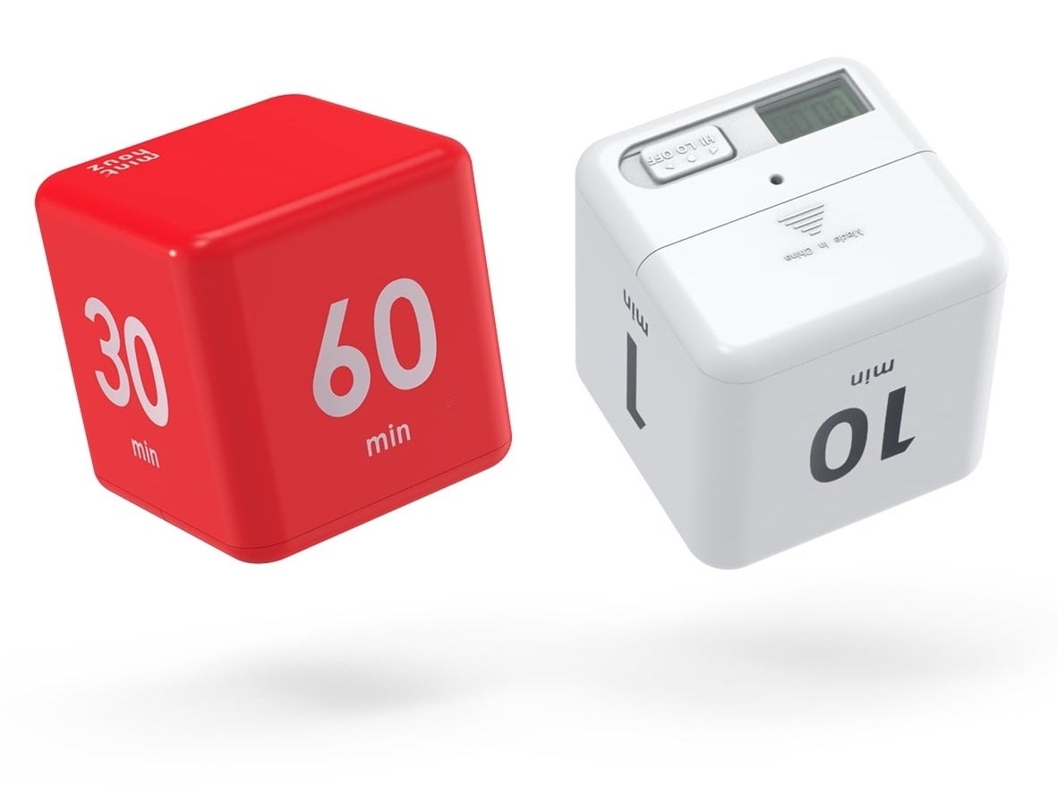 Two cube-shaped kitchen timers, one red, one white, one set on 30 and 10 minutes