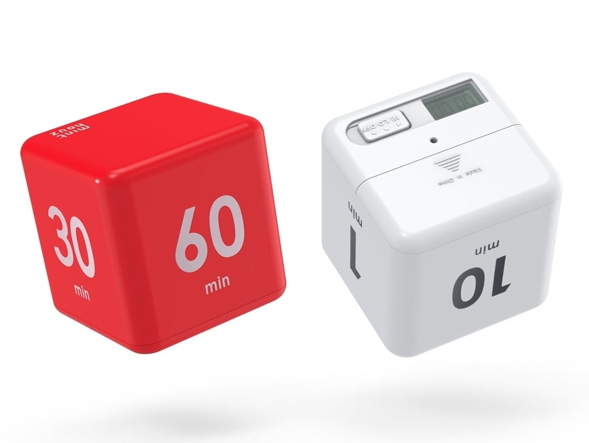 Two cube-shaped kitchen timers, one red, one white, one set on 30 and 10 minutes