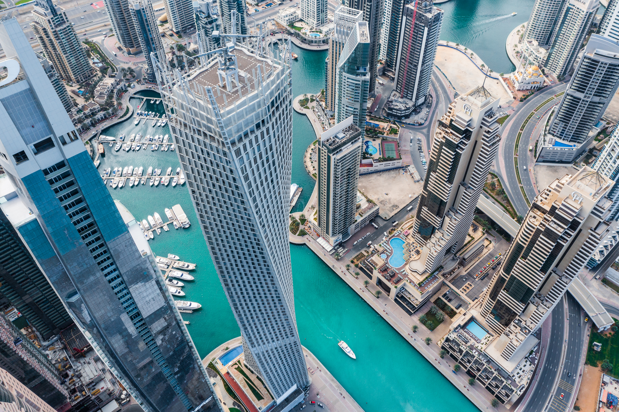 Aerial view of Dubai Marina futuristic skyline with a man-made lake in the middle