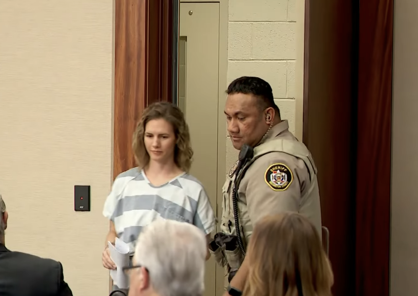 Ruby Franke with a deputy in a courtroom setting