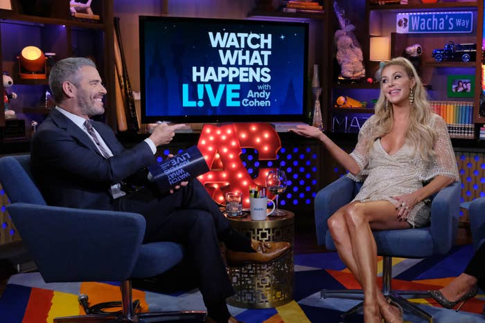 Andy Cohen and Brandi on &quot;Watch What Happens Live,&quot; both seated and smiling, she in a short beaded dress