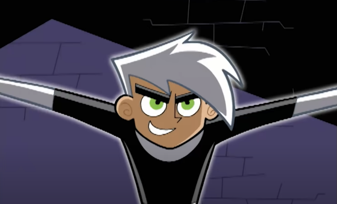 Animated character Danny Phantom flying with a confident smile