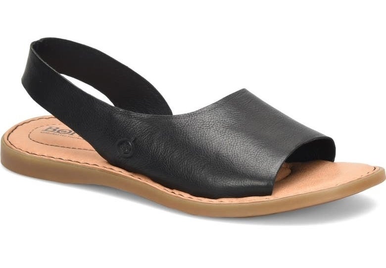 black slide sandal with a single wide strap and flat sole