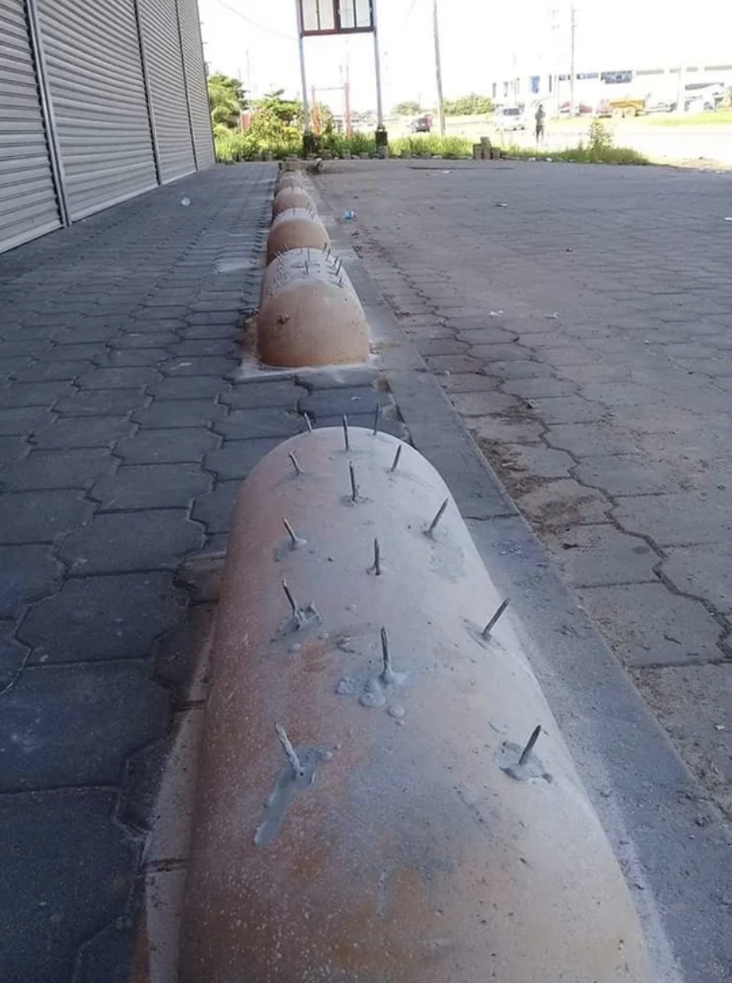 Concrete barriers with metal spikes to deter skateboarding or sitting