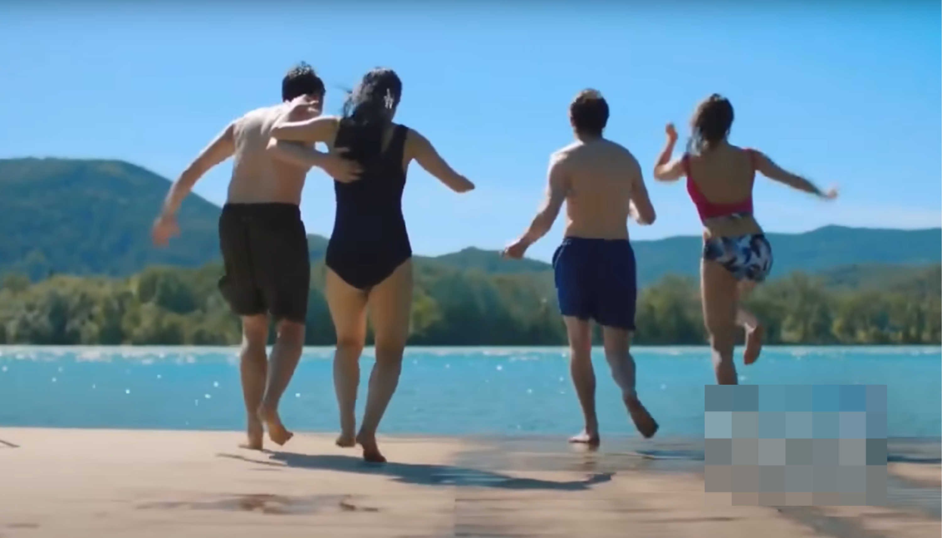 Four friends holding hands and jumping into a lake, with text for Skyrizi, an advertised medication