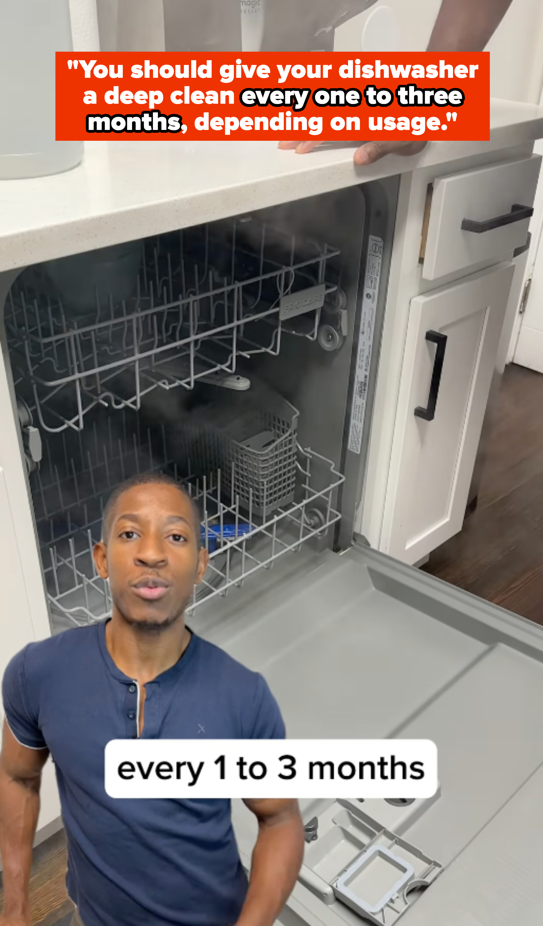 Kyshawn in kitchen standing near open dishwasher, text overlay: &quot;You should give your dishwasher a deep clean every one to three months, depending on usage&quot;