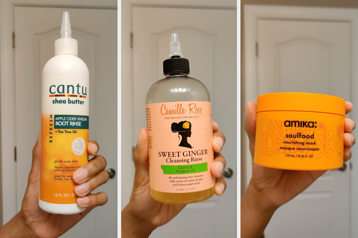 A hand holding three different hair care products: Cantu Apple Cider Vinegar Root Rinse, Camille Rose Cleansing Rinse, and the Amika hair mask
