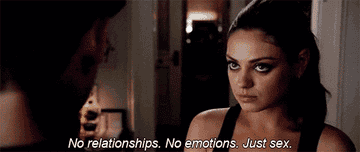 Mila Kunis in a film scene, conveying a friends-with-benefits stance by stating no relationships or emotions, just sex