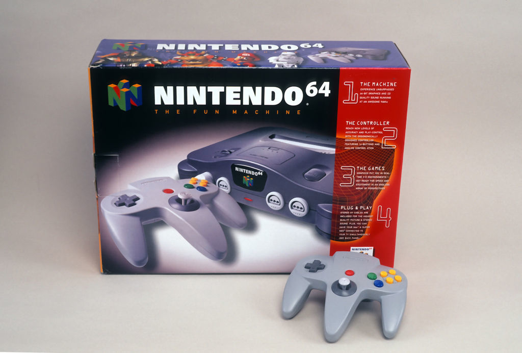 Vintage Nintendo 64 packaging with console and controllers for a retro gaming article