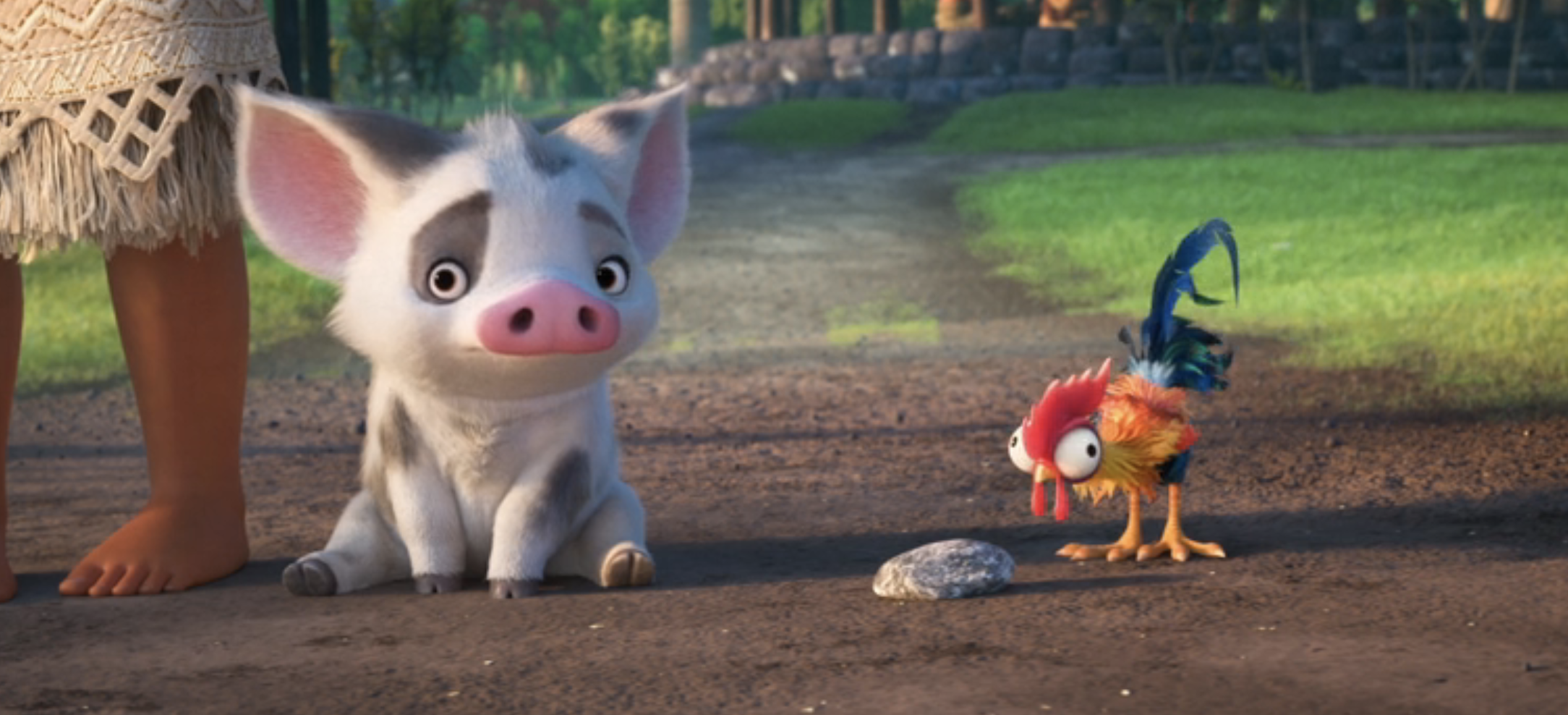 Pua the pig and Heihei the rooster from &quot;Moana&quot; looking curiously at a stone