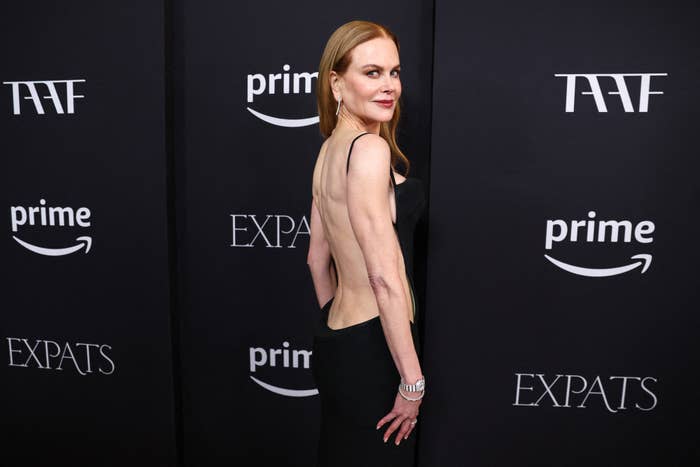 Nicole Kidman in a black dress, posing with her side to the camera at a Prime event