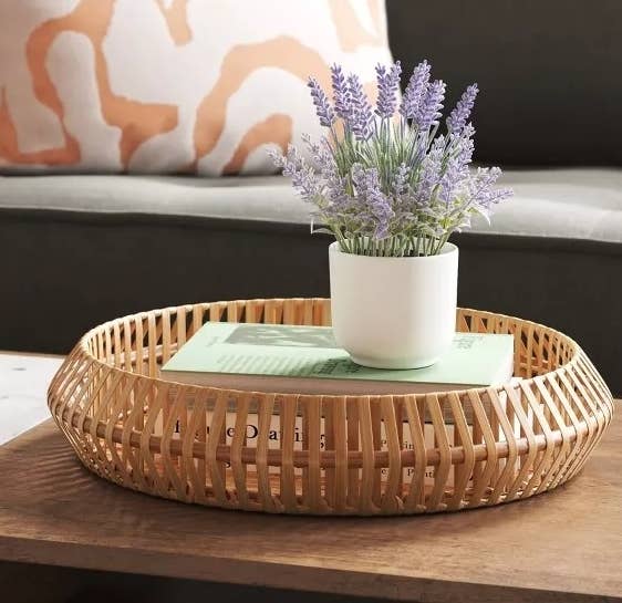 The white potted artificial lavender on a coffee table