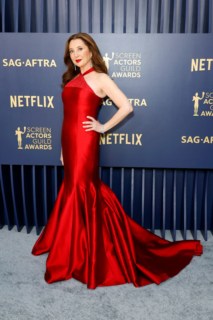 Donna Murphy in an elegant mermaid-style gown with a slight train
