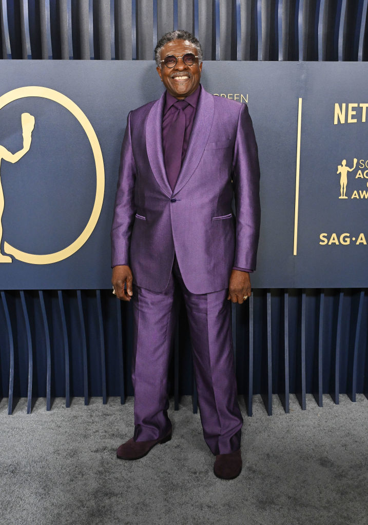 Keith David in a bright shiny suit and velvet shoes