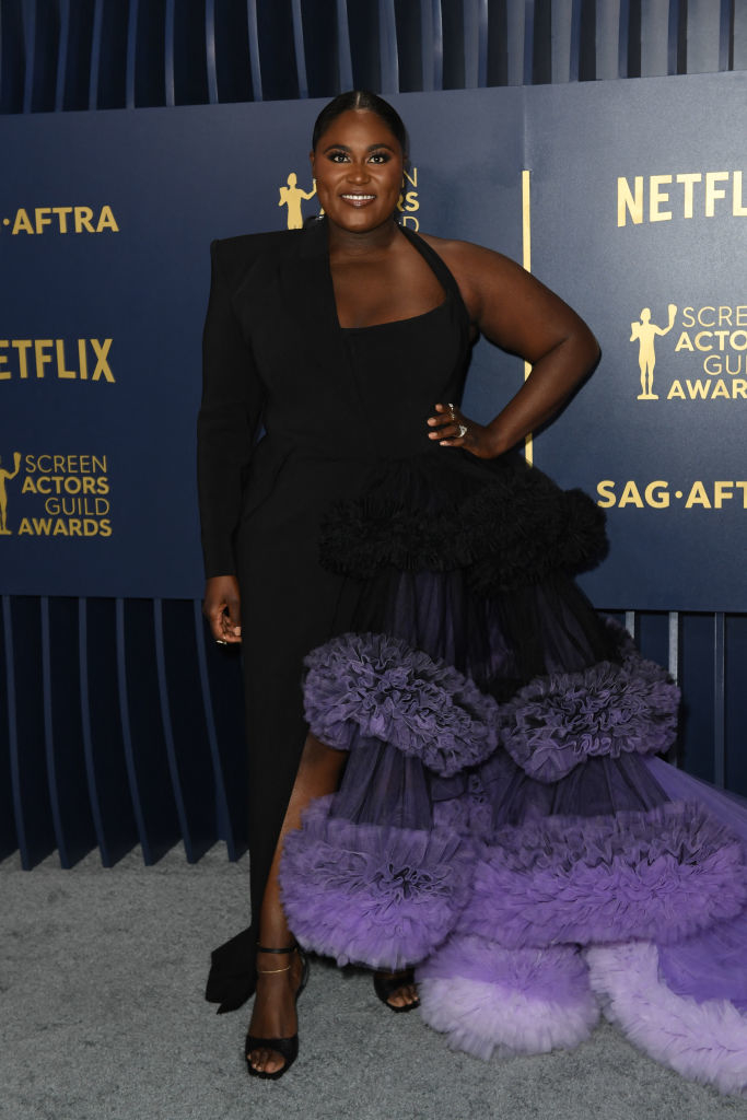 Danielle Brooks in a half suit half tiered dress with ruffles
