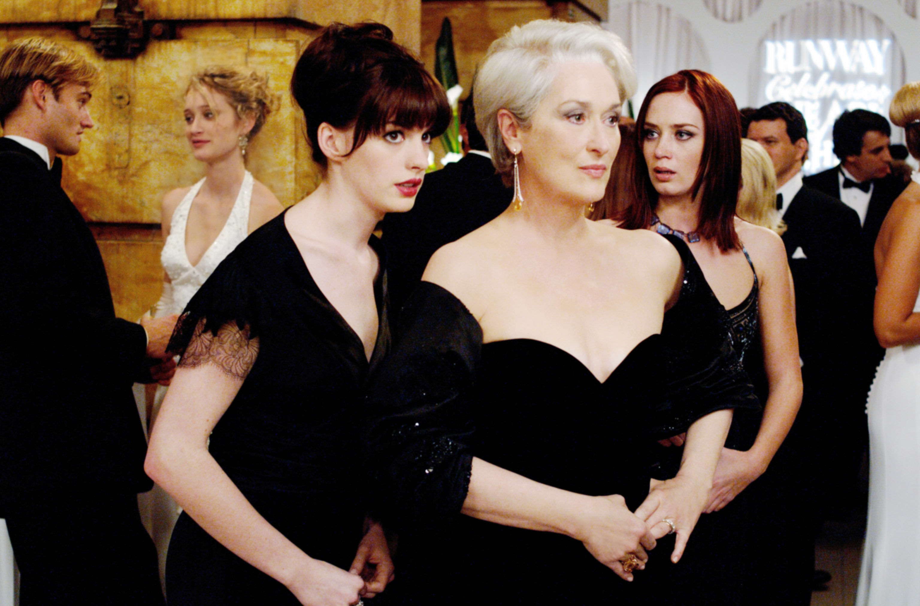 Anne Hathaway and Emily Blunt on each side of Meryl Streep in &#x27;The Devil Wears Prada&#x27;