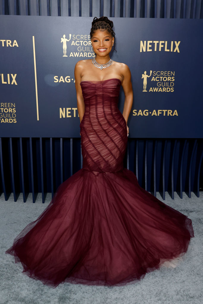 Halle Bailey in a strapless ruched gown with a flared tulle mermaid skirt