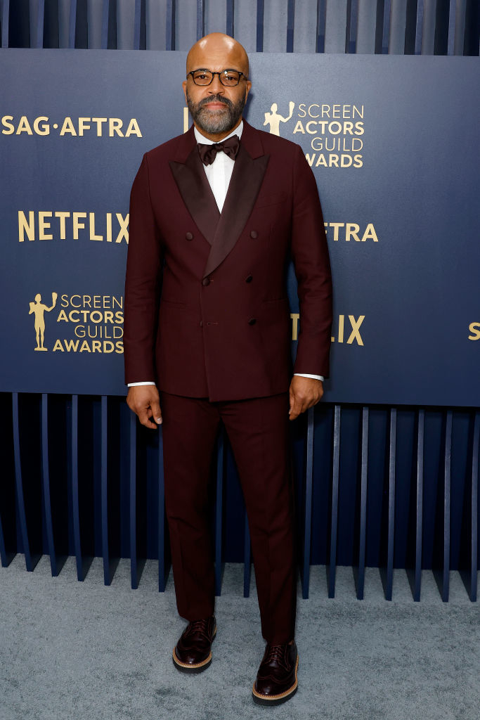 Jeffrey Wright wearing a double-breasted burgundy suit with a bow tie