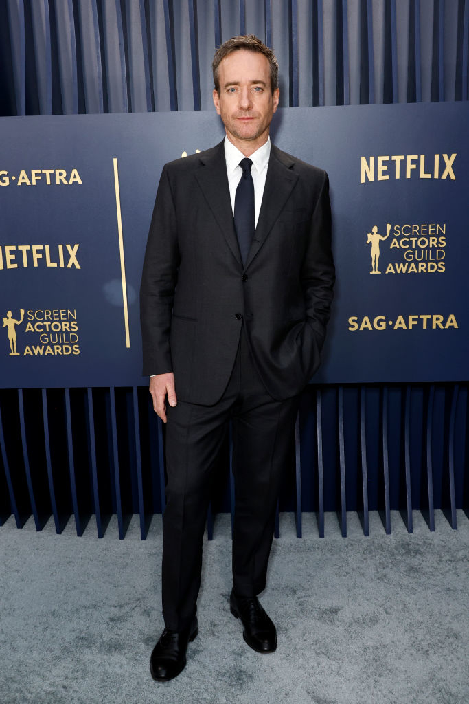 Matthew Macfadyen  in a suit and tie