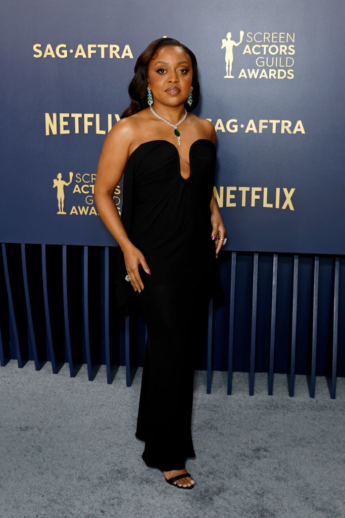 Quinta Brunson in black strapless gown and strappy heels